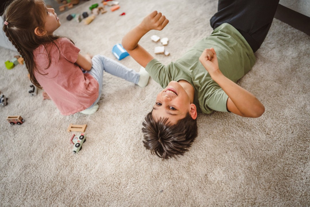 Kids playing on the carpet during the summer