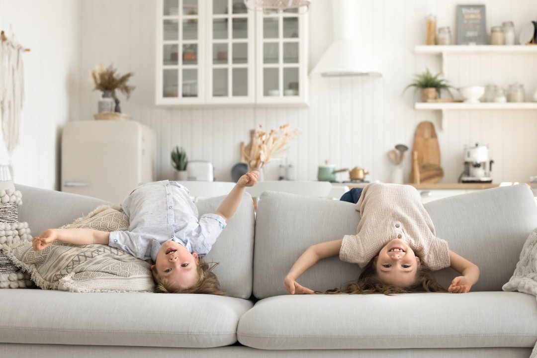 Kids playing on the couch at home