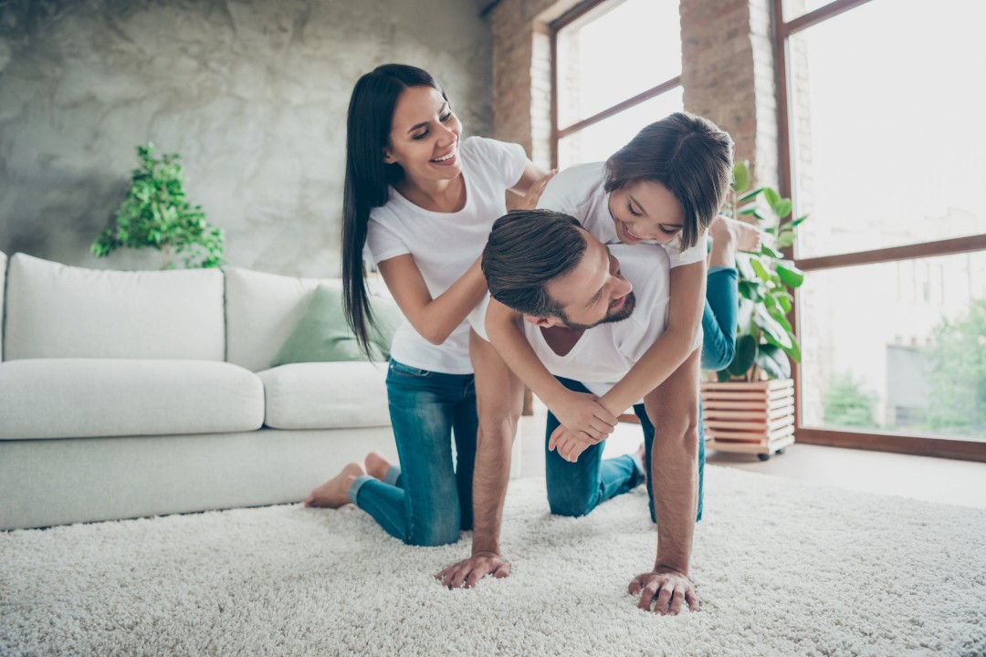 Family enjoying clean carpet at home